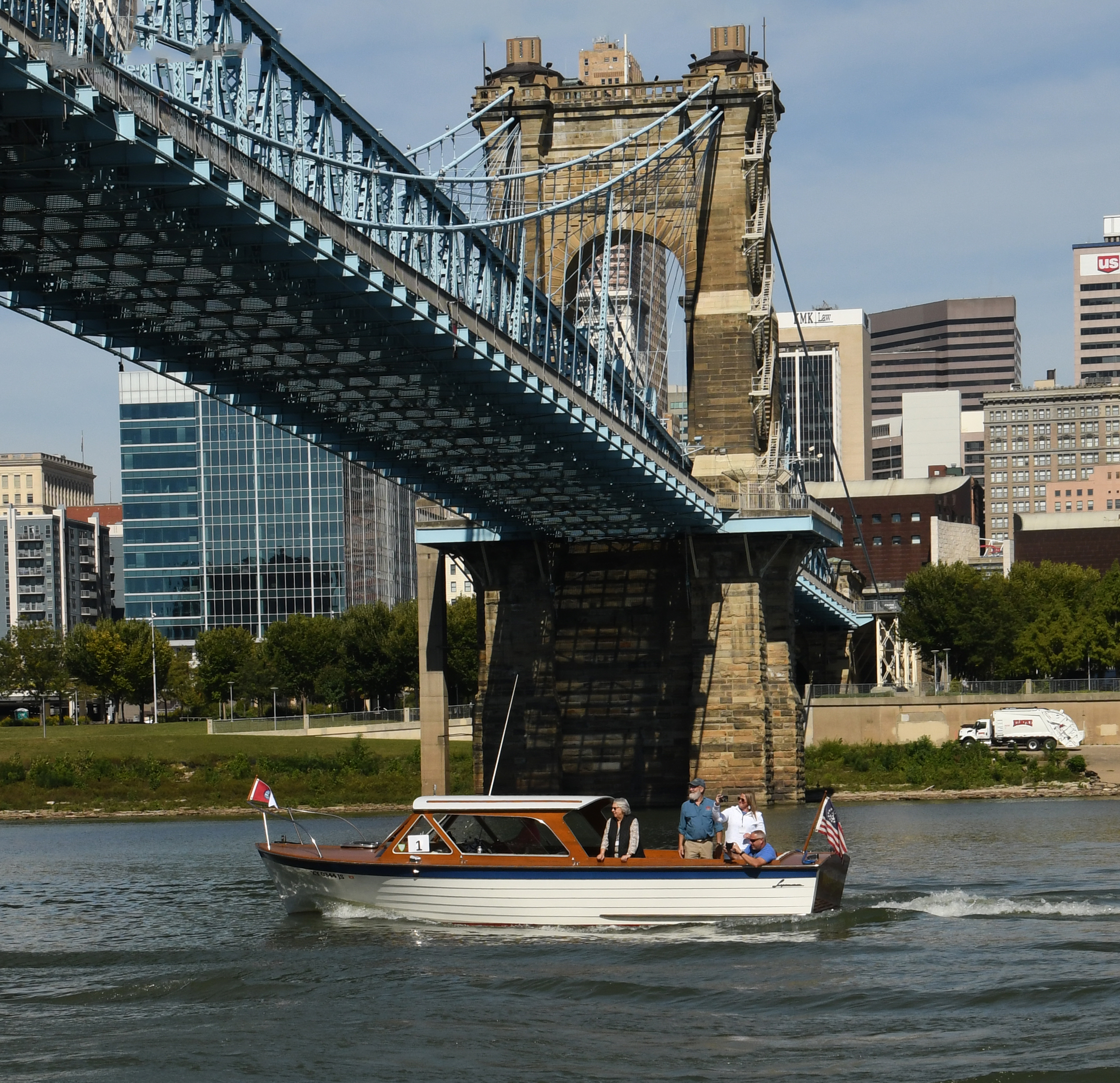 Boats passing under the Roebling Bridge